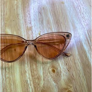 Pink cat eye sunglasses.